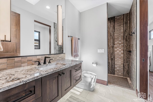2523 N Chaco Trl, St George, UT 84770 - bathroom with vanity, toilet, walk in shower, tasteful backsplash, and baseboards