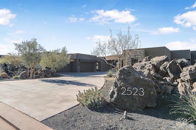 2523 N Chaco Trl, St George, UT 84770 - southwest-style home featuring driveway, stucco siding, and a garage