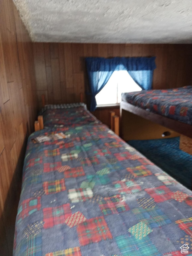 80 S Chipper Ln, Manila, UT 84046 - bedroom with wooden walls and a textured ceiling