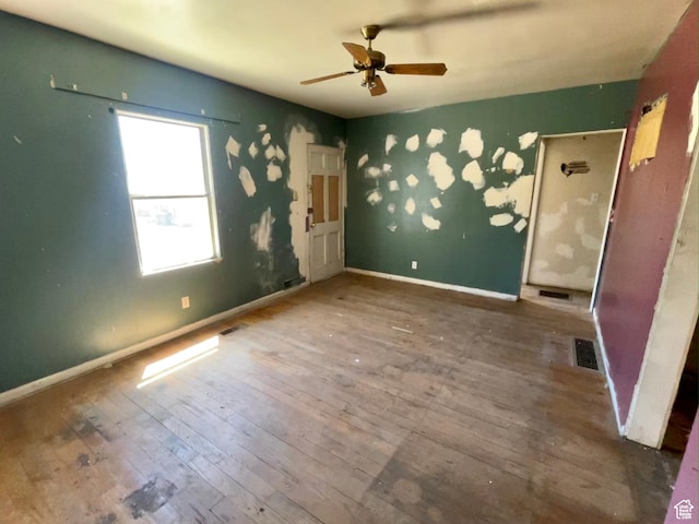 unfurnished bedroom featuring hardwood / wood-style flooring and ceiling fan