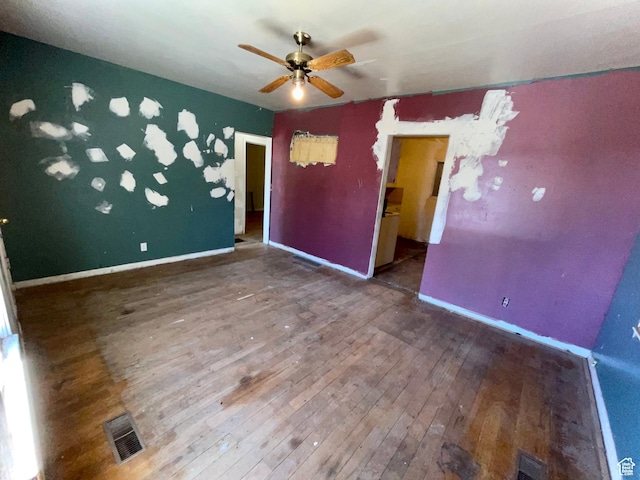 unfurnished bedroom featuring ceiling fan and hardwood / wood-style flooring