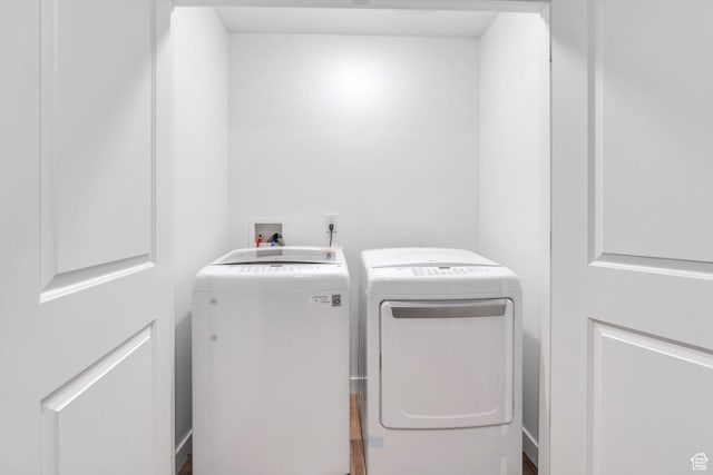 washroom with washer and dryer