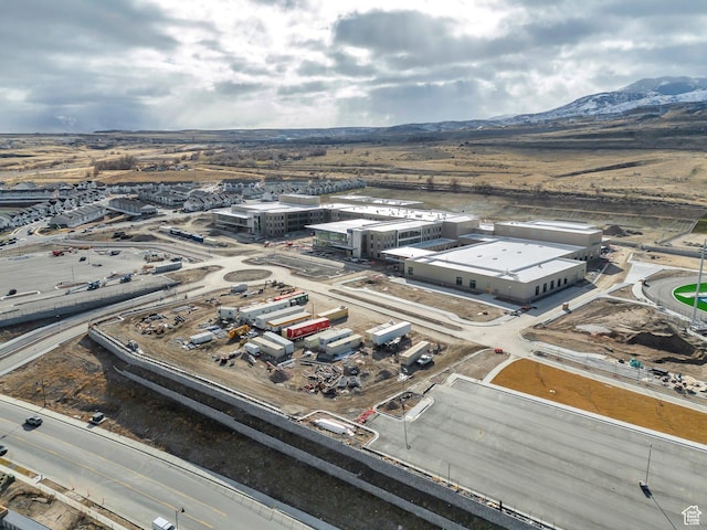 birds eye view of property with a mountain view