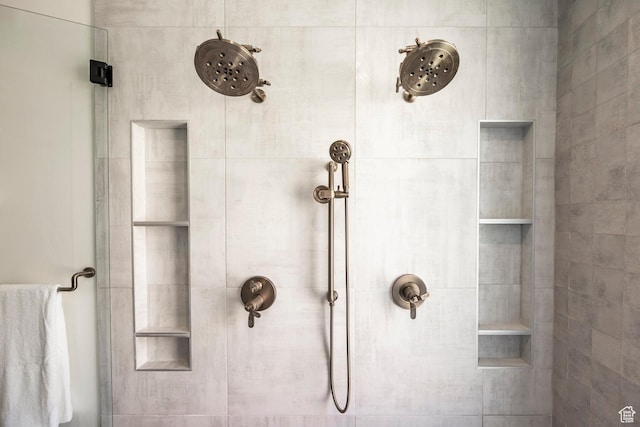 bathroom with a tile shower