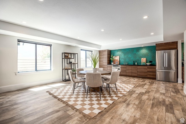 dining area with light wood-type flooring