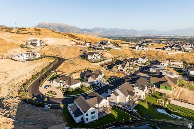 birds eye view of property with a mountain view