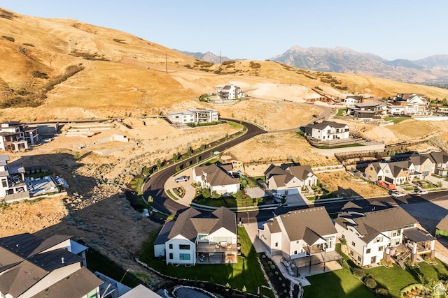 birds eye view of property with a mountain view