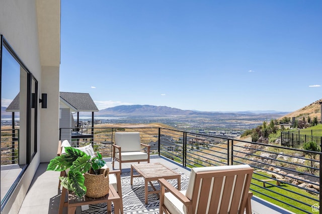 balcony with a mountain view and an outdoor living space