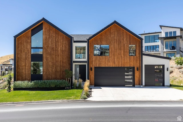 modern home with a garage and a front yard
