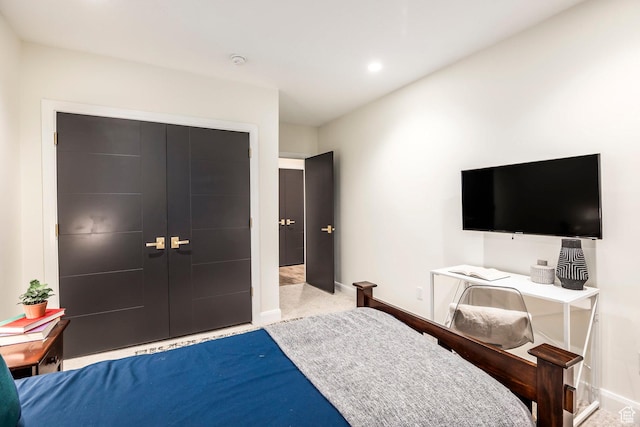 carpeted bedroom featuring a closet