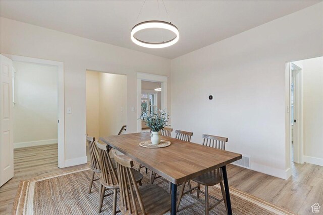 dining room with light hardwood / wood-style flooring