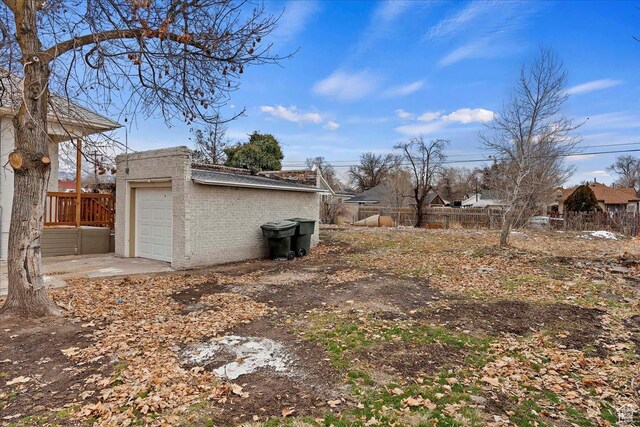exterior space with a garage and an outdoor structure