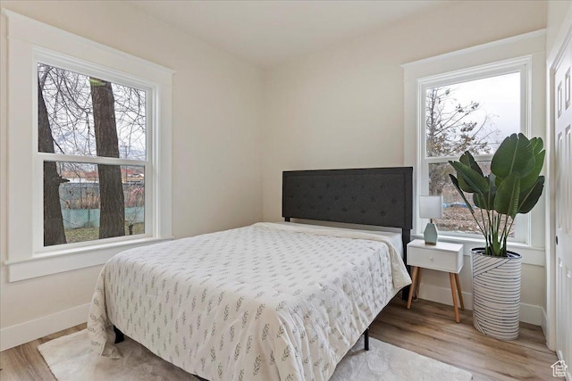 bedroom featuring light wood-type flooring