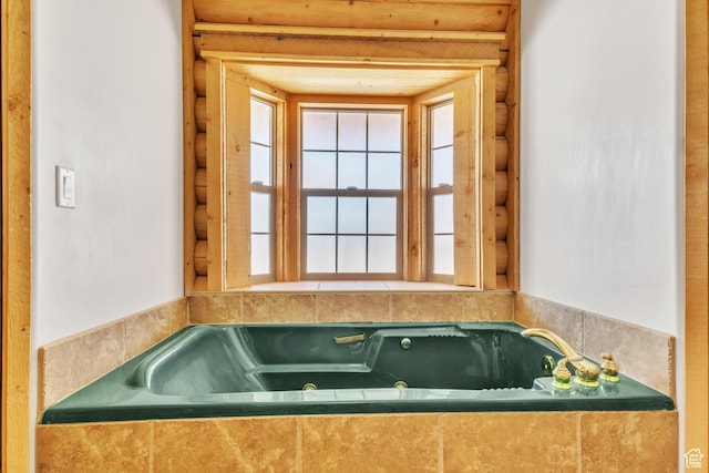 bathroom with tiled tub