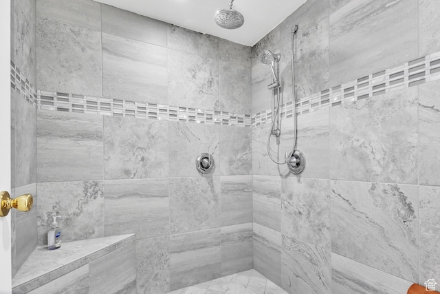 bathroom with tiled shower