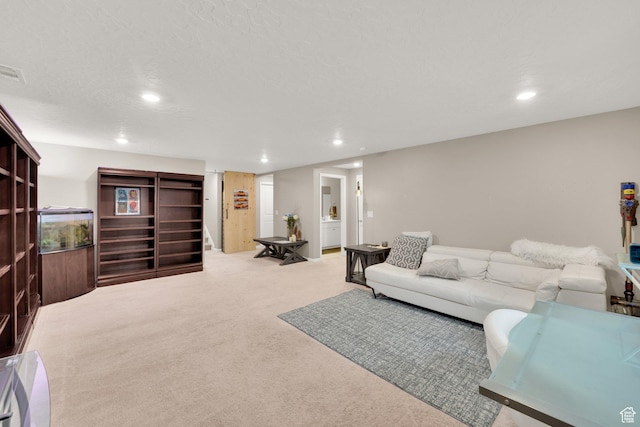 carpeted living room featuring recessed lighting