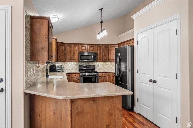 4876 S 1525 E, Ogden, UT 84403 - kitchen with a sink, appliances with stainless steel finishes, a peninsula, light countertops, and vaulted ceiling