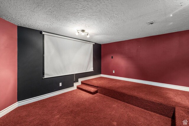 4876 S 1525 E, Ogden, UT 84403 - carpeted home theater room with baseboards and a textured ceiling