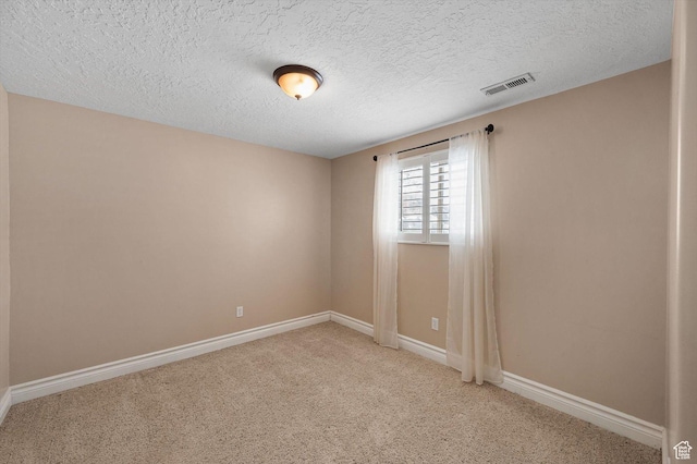 4876 S 1525 E, Ogden, UT 84403 - spare room with a textured ceiling, light colored carpet, visible vents, and baseboards
