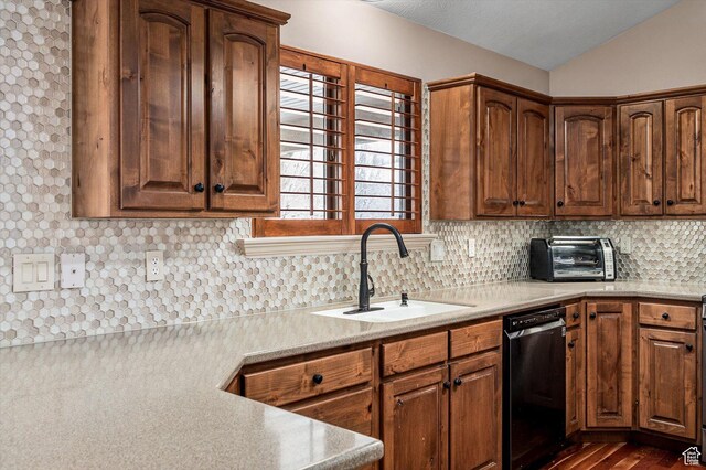 4876 S 1525 E, Ogden, UT 84403 - kitchen with dishwashing machine, a toaster, a sink, vaulted ceiling, and backsplash
