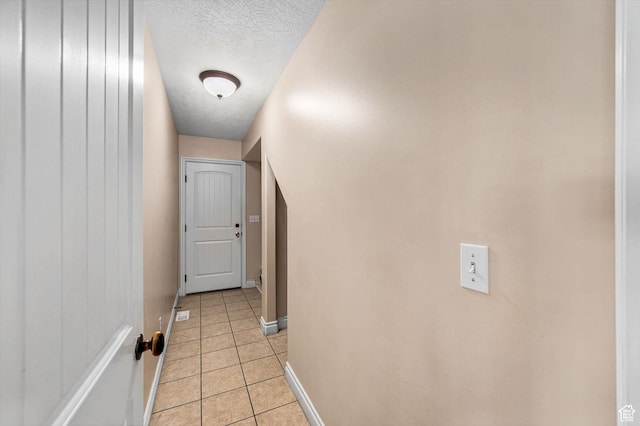 4876 S 1525 E, Ogden, UT 84403 - corridor featuring light tile patterned floors, baseboards, and a textured ceiling