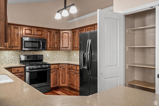 4876 S 1525 E, Ogden, UT 84403 - kitchen featuring stainless steel range with gas stovetop, light countertops, crown molding, backsplash, and black refrigerator with ice dispenser