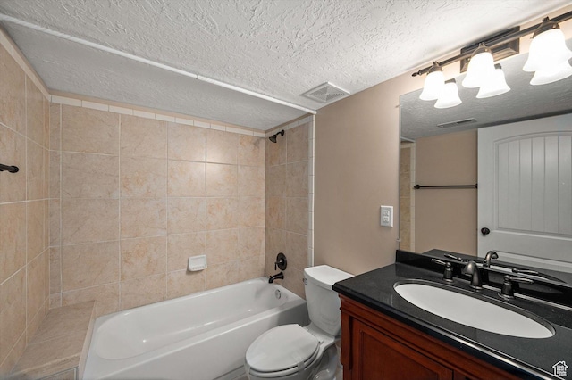 4876 S 1525 E, Ogden, UT 84403 - full bath featuring vanity, toilet, visible vents, and a textured ceiling