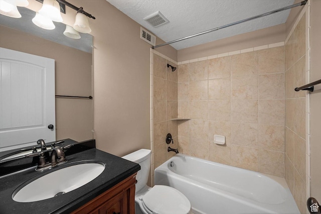 4876 S 1525 E, Ogden, UT 84403 - full bath featuring bathing tub / shower combination, toilet, visible vents, and a textured ceiling