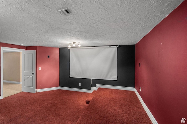 4876 S 1525 E, Ogden, UT 84403 - carpeted home theater room featuring visible vents, baseboards, and a textured ceiling