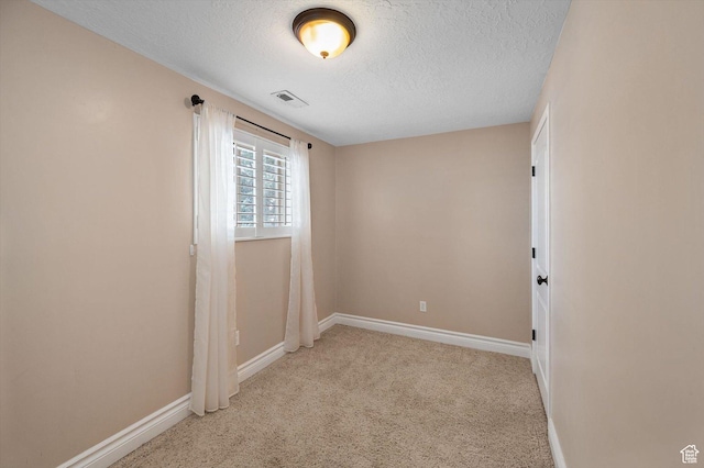 4876 S 1525 E, Ogden, UT 84403 - unfurnished room with visible vents, light colored carpet, baseboards, and a textured ceiling