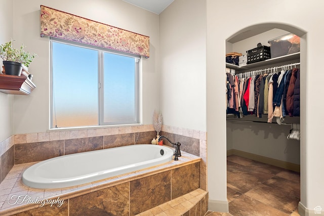 bathroom featuring tiled bath