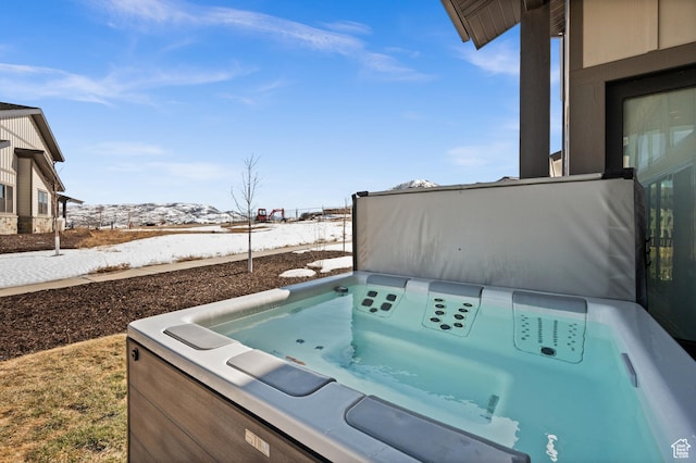 view of patio / terrace with a hot tub