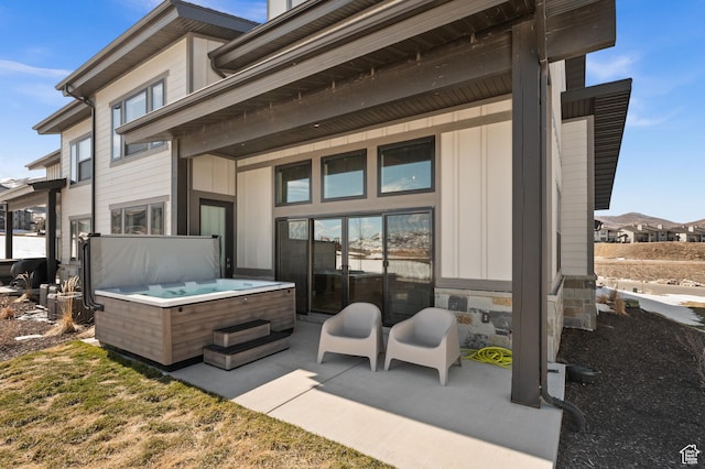 view of patio / terrace with a hot tub
