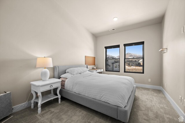 bedroom featuring visible vents, baseboards, and carpet floors