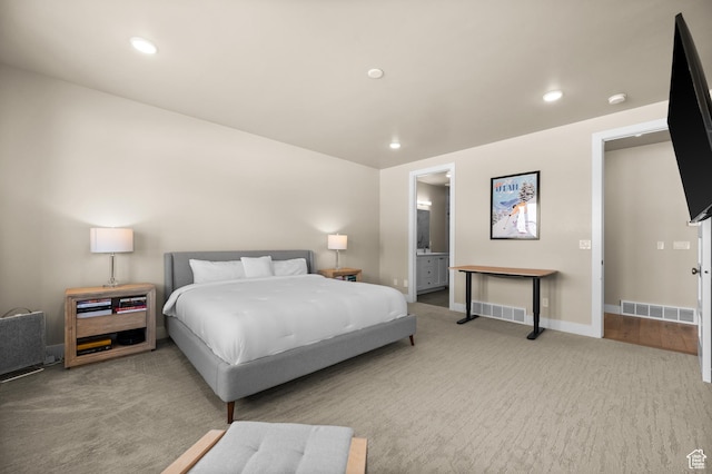 carpeted bedroom featuring recessed lighting, baseboards, and visible vents