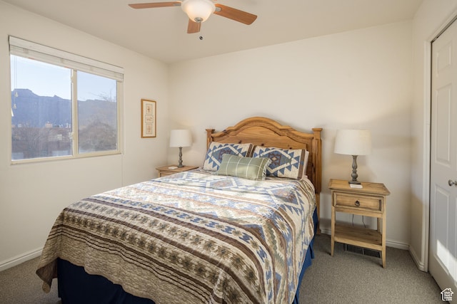 3253 E Fairway Loop, Moab, UT 84532 - carpeted bedroom with ceiling fan and a mountain view