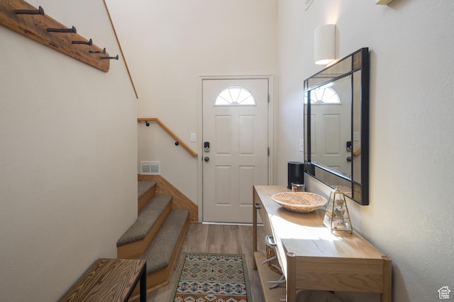 3253 E Fairway Loop, Moab, UT 84532 - foyer entrance featuring a high ceiling and light hardwood / wood-style flooring