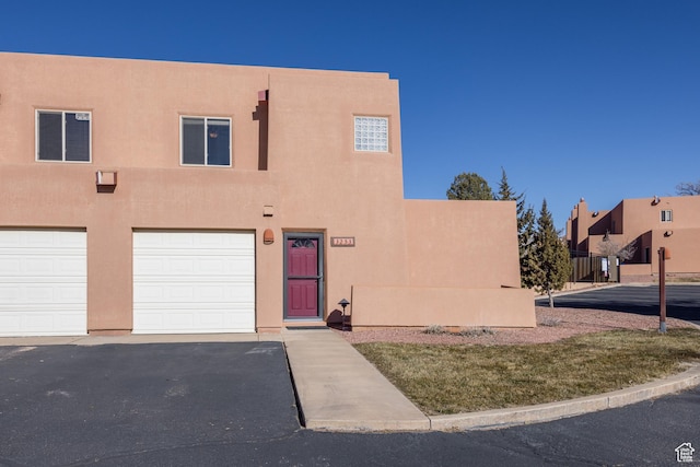 3253 E Fairway Loop, Moab, UT 84532 - adobe home featuring a garage