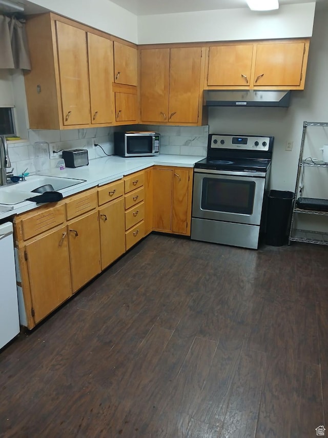 237 N 500 W, Vernal, UT 84078 - kitchen with appliances with stainless steel finishes, exhaust hood, dark wood finished floors, light countertops, and tasteful backsplash