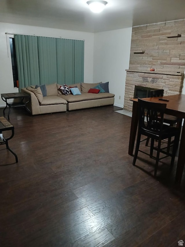 237 N 500 W, Vernal, UT 84078 - living room featuring a fireplace and dark wood-style flooring