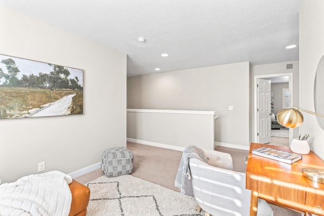 living area featuring carpet flooring, recessed lighting, visible vents, and baseboards