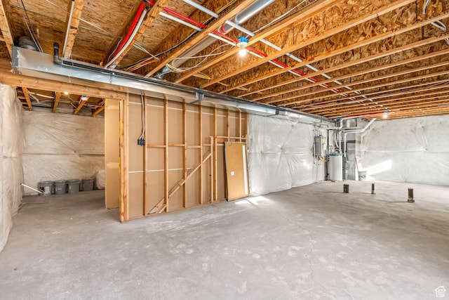 unfinished basement featuring water heater
