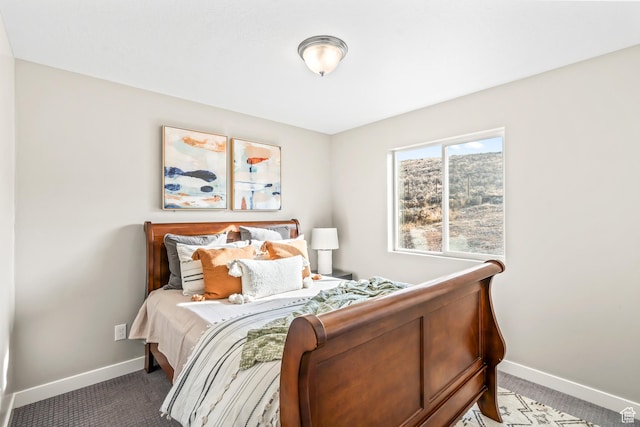 carpeted bedroom with baseboards