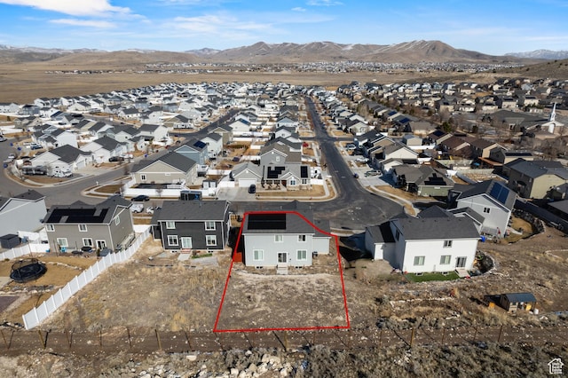 aerial view featuring a mountain view and a residential view