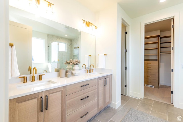 7277 W Hall Crossing Dr S, Herriman, UT 84096 - bathroom with a stall shower, double vanity, a sink, and a walk in closet