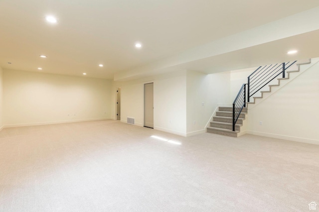 7277 W Hall Crossing Dr S, Herriman, UT 84096 - finished basement featuring light colored carpet, visible vents, stairway, recessed lighting, and baseboards