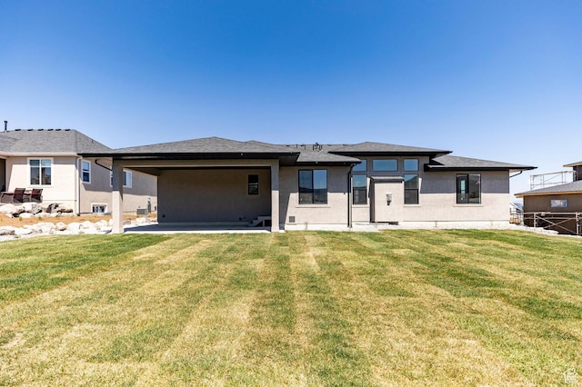 7277 W Hall Crossing Dr S, Herriman, UT 84096 - prairie-style home featuring a patio, a front yard, and stucco siding