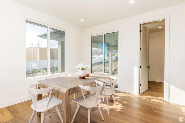7277 W Hall Crossing Dr S, Herriman, UT 84096 - dining space featuring light wood-type flooring, baseboards, and recessed lighting