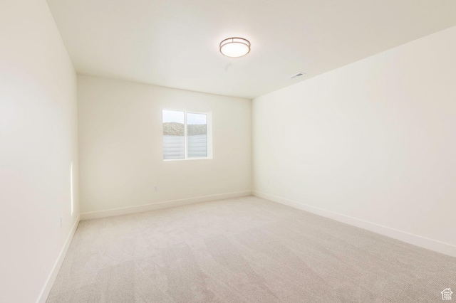 7277 W Hall Crossing Dr S, Herriman, UT 84096 - unfurnished room featuring light carpet, baseboards, and visible vents