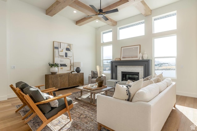 7277 W Hall Crossing Dr S, Herriman, UT 84096 - living area with baseboards, light wood-type flooring, beamed ceiling, and coffered ceiling